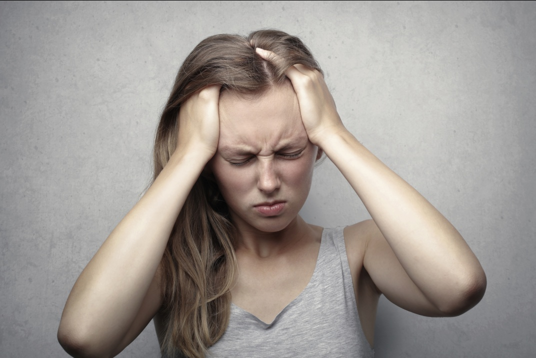 A woman having a headache